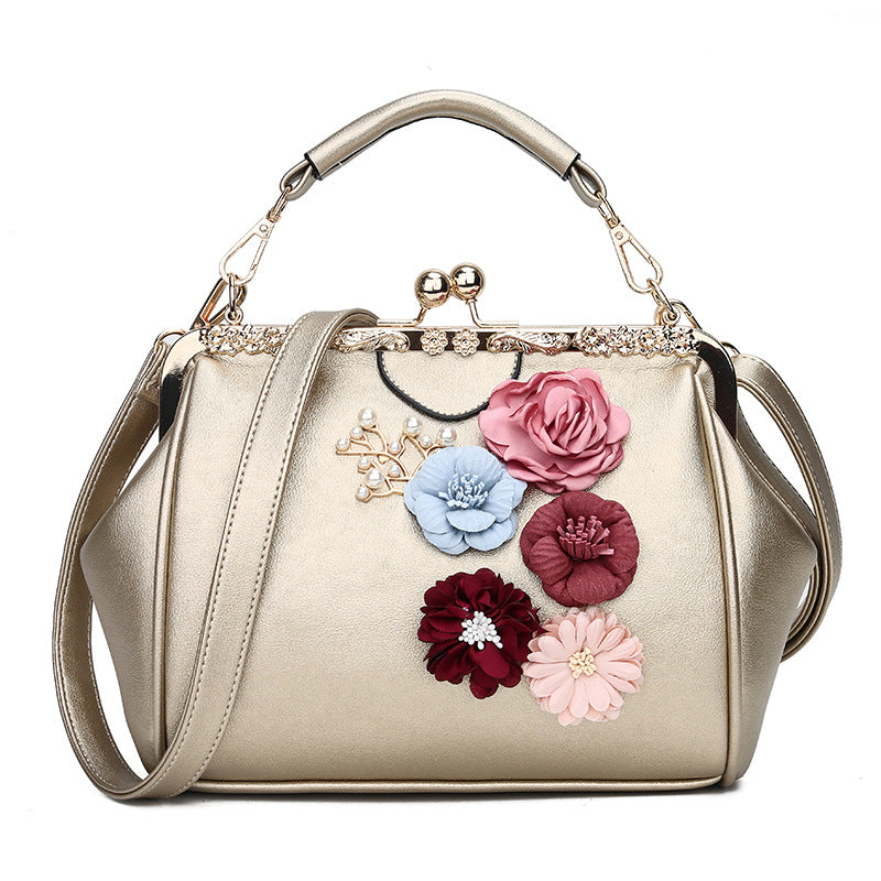 Embossed flower metal clip handbag
